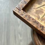 Antique wooden tray depicting a family scene