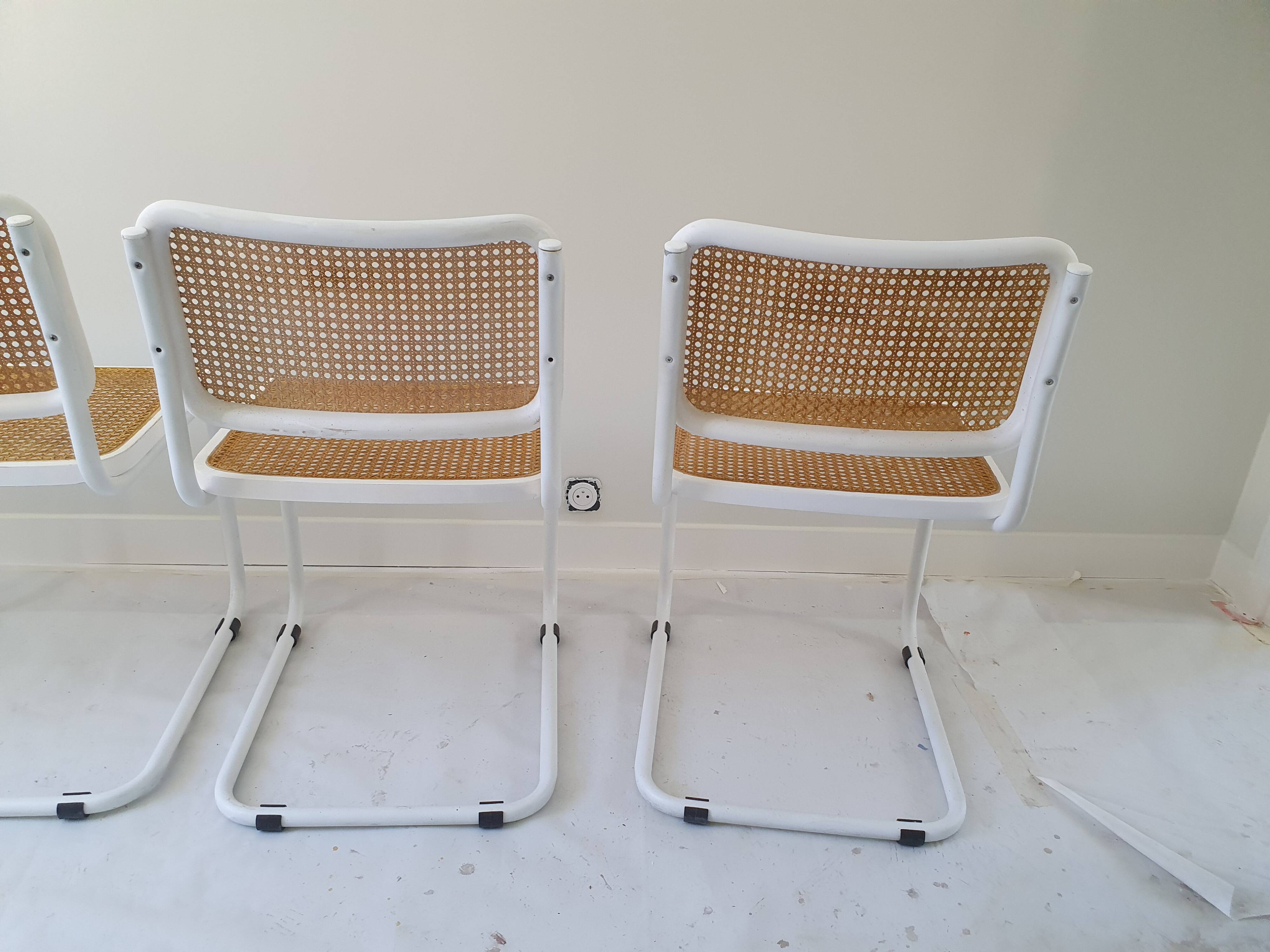 B32 chairs by Marcel Breuer in white.