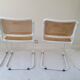 B32 chairs by Marcel Breuer in white.