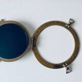 Porthole mirror in gilded brass