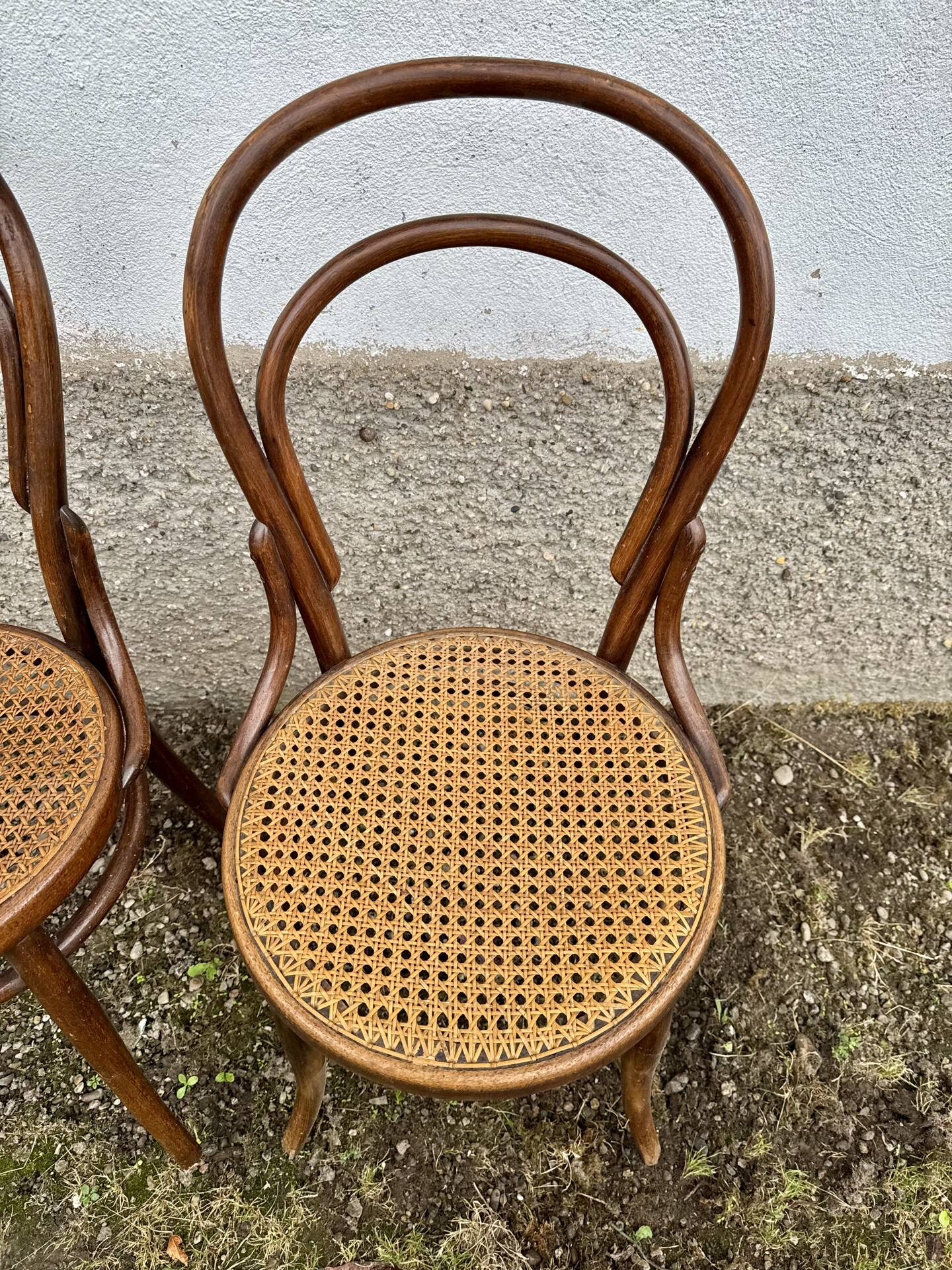 Set of 10 bentwood bistro chairs with cane seat.