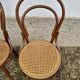Set of 10 bentwood bistro chairs with cane seat.