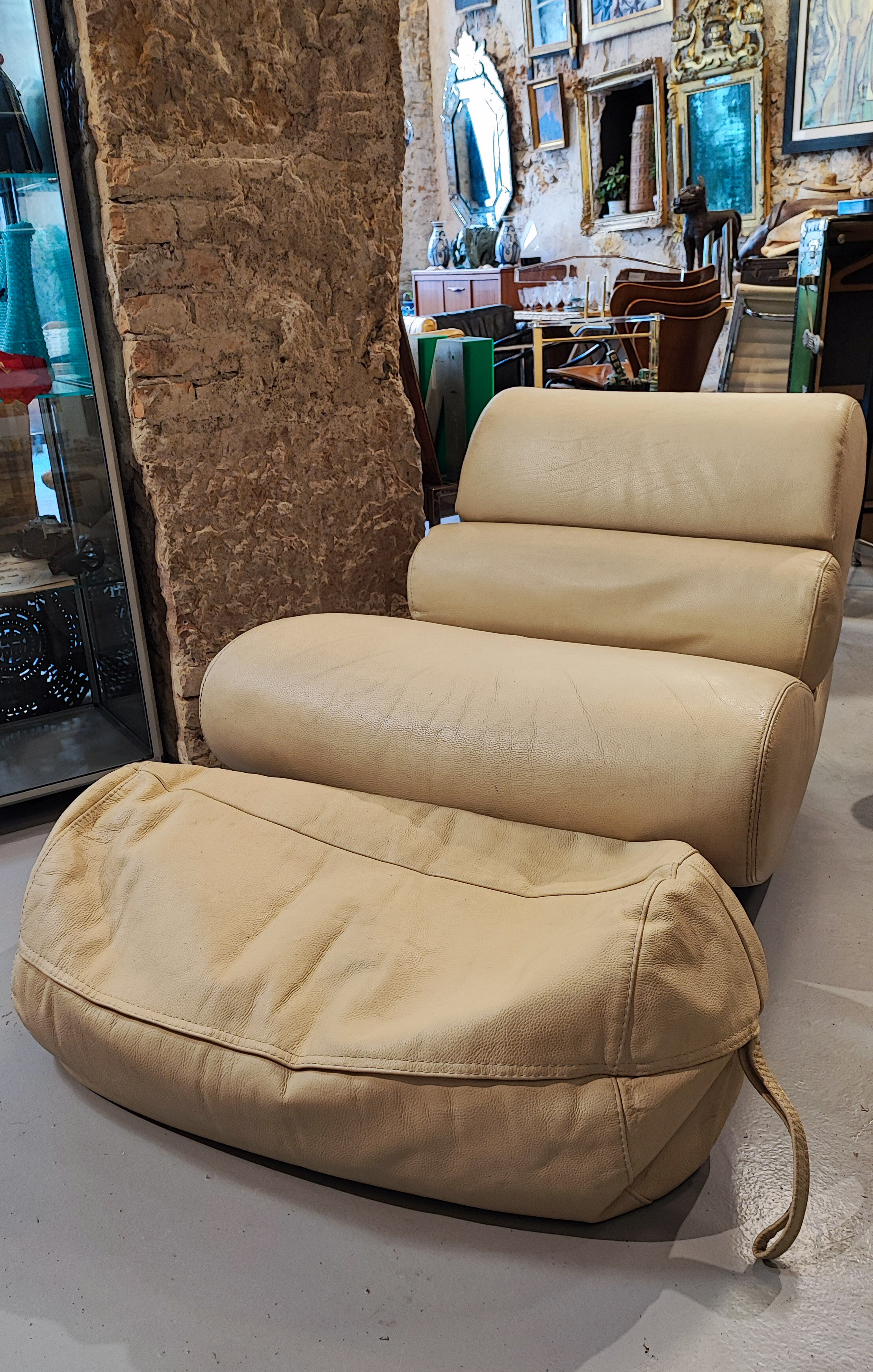 Armchair and footrest Comgule Roche Bobois leather
