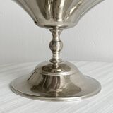 large dish on a shiny metal stand