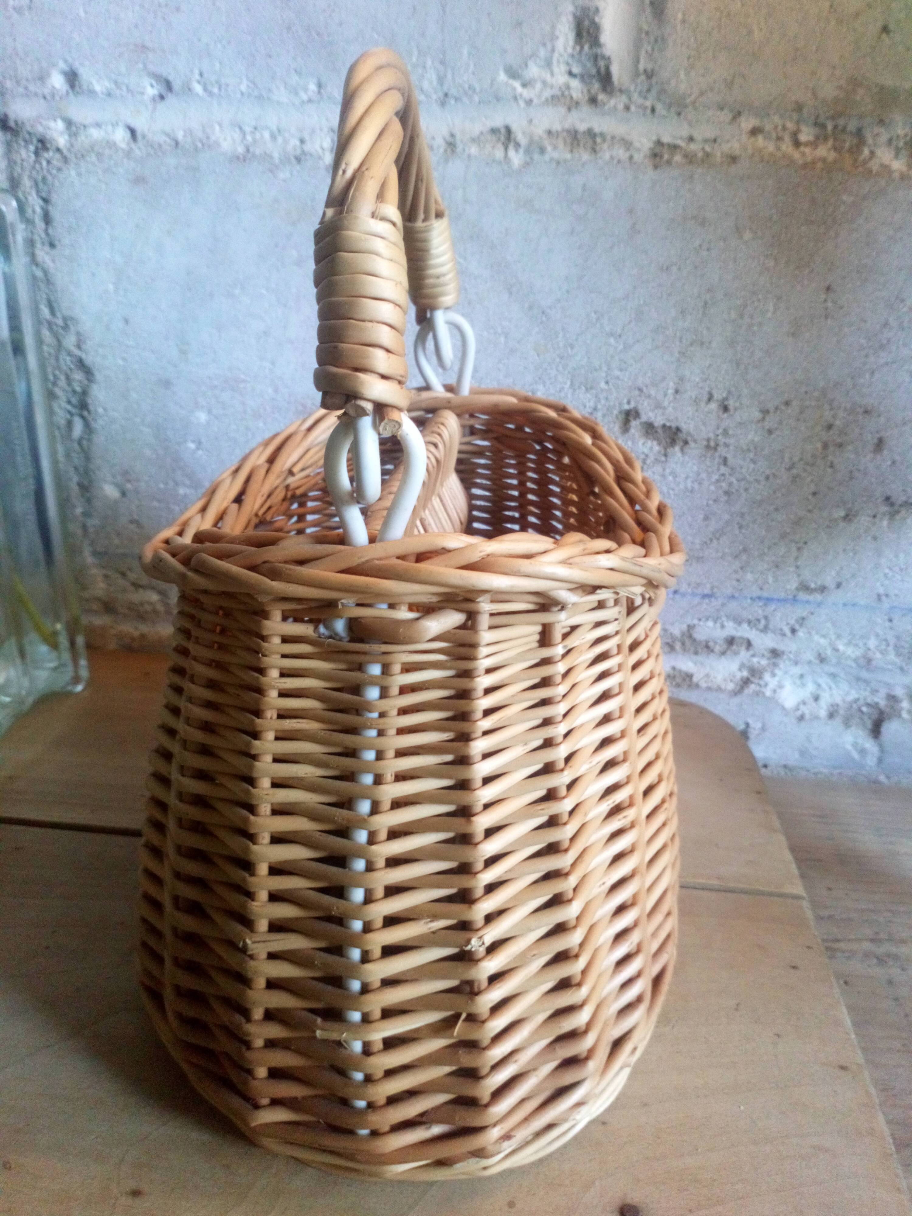 Covered rattan basket for lunch on 50s grass