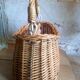 Covered rattan basket for lunch on 50s grass