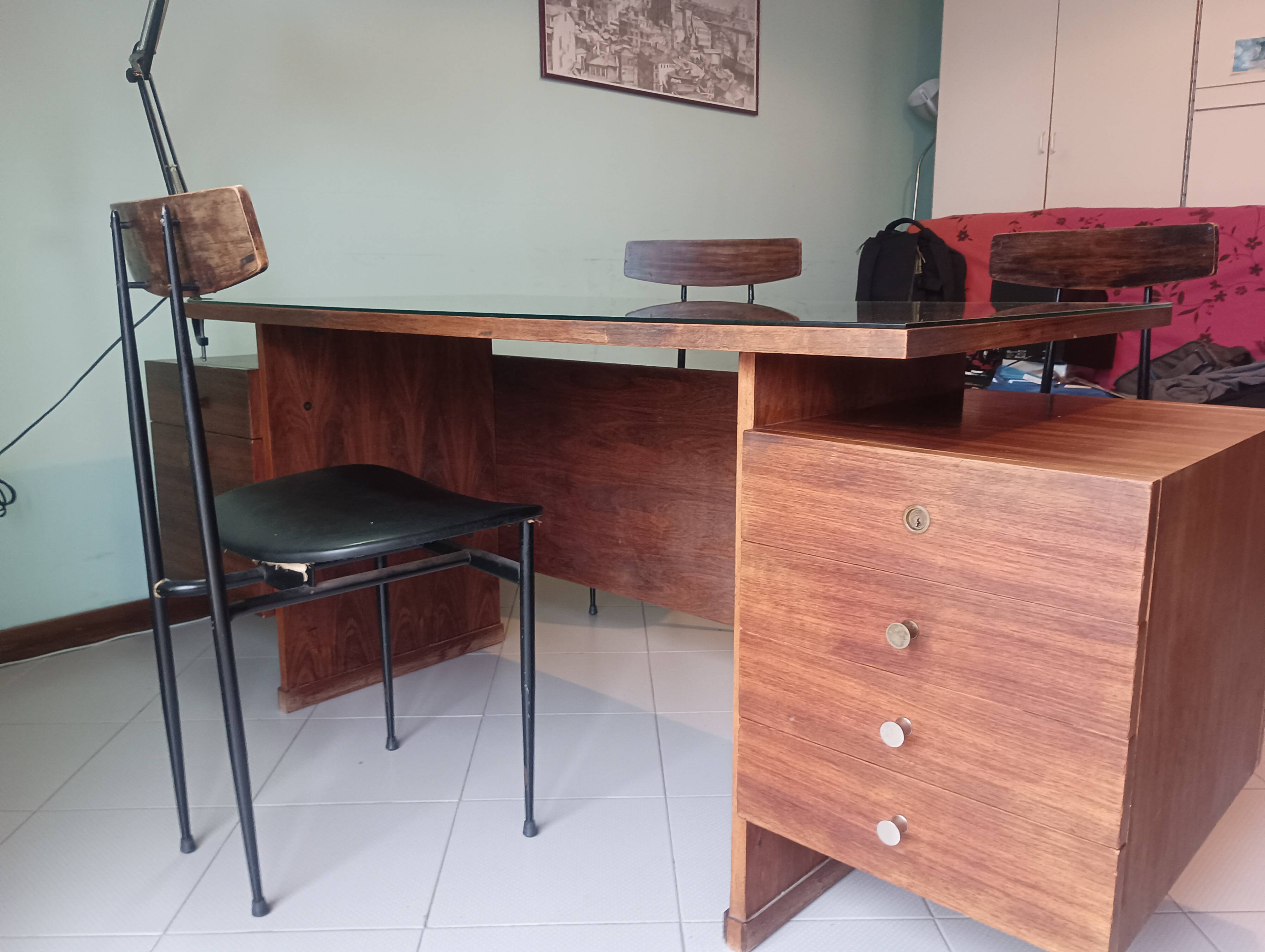 Desk and 3 chairs in 1950s Italian modernist style in rosewood.