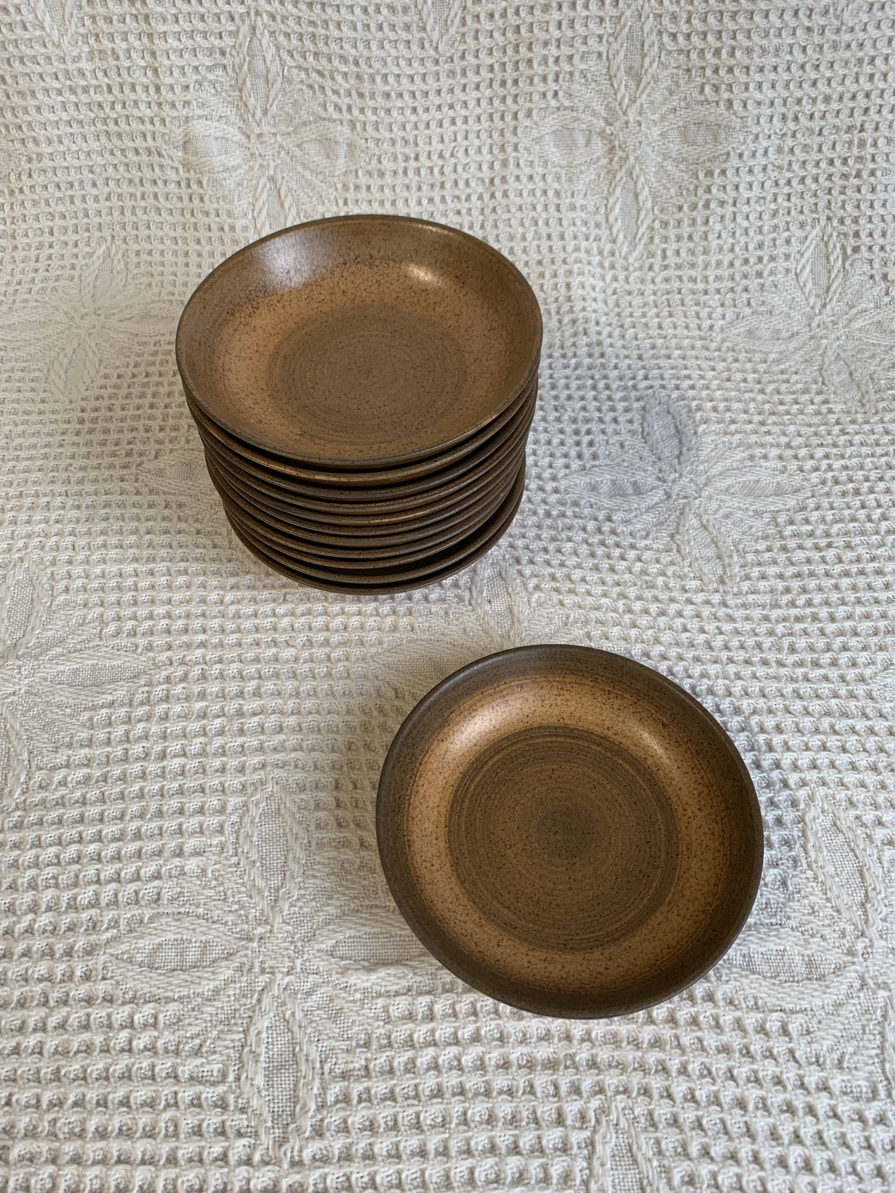 6 Longchamp brown enameled stoneware soup plates, 1970s