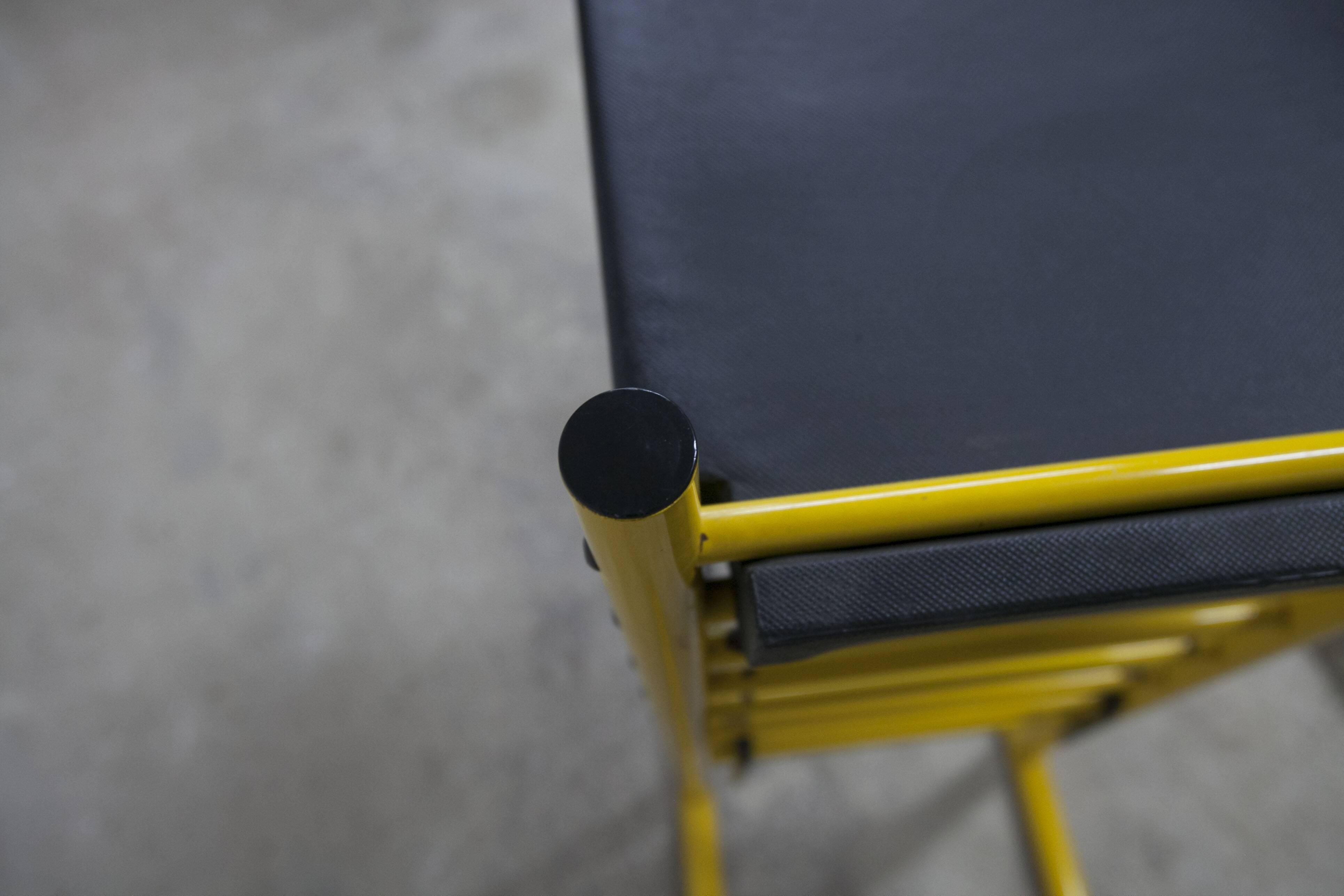 Pair of adjustable Italian bar stools in lacquered yellow and black