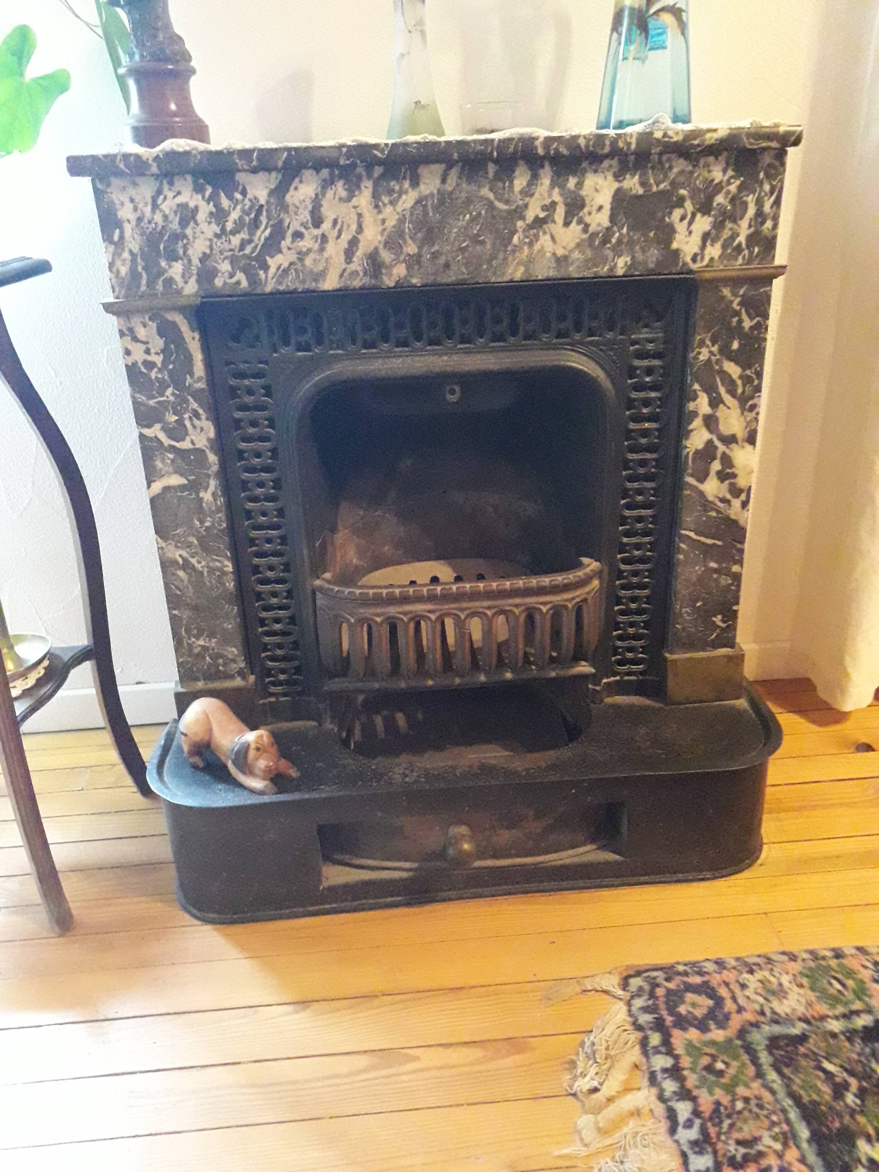 Old black marble fireplace