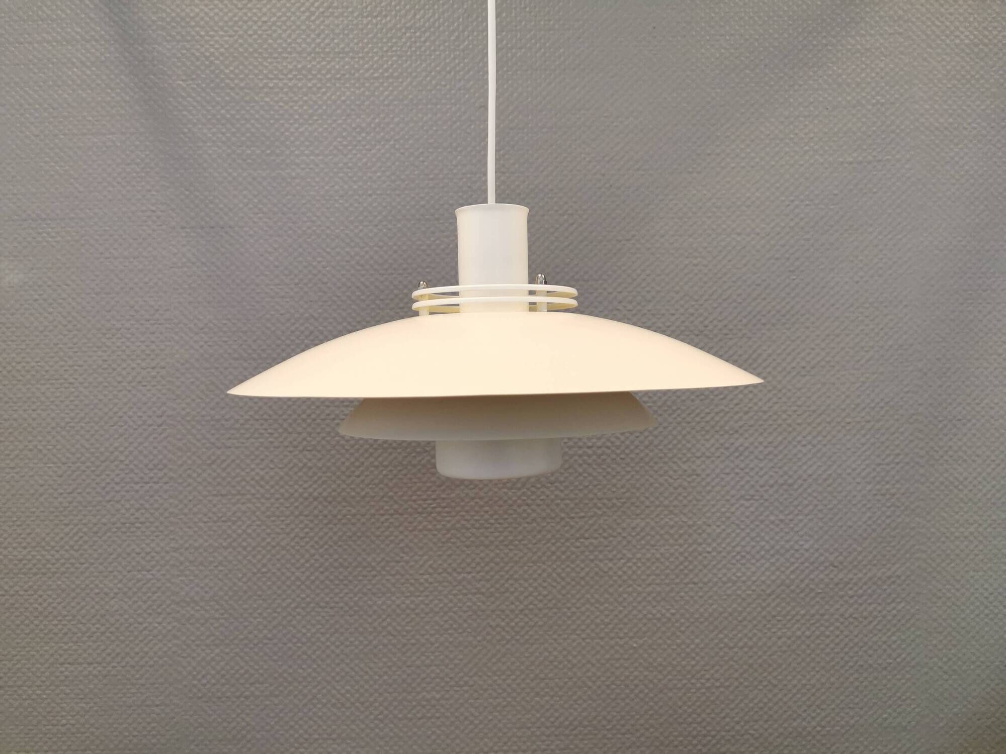 FormLight hanging lamp with multiple layers of shades, a Danish quality product from the 80s.