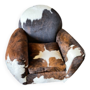 Fauteuils club en peau