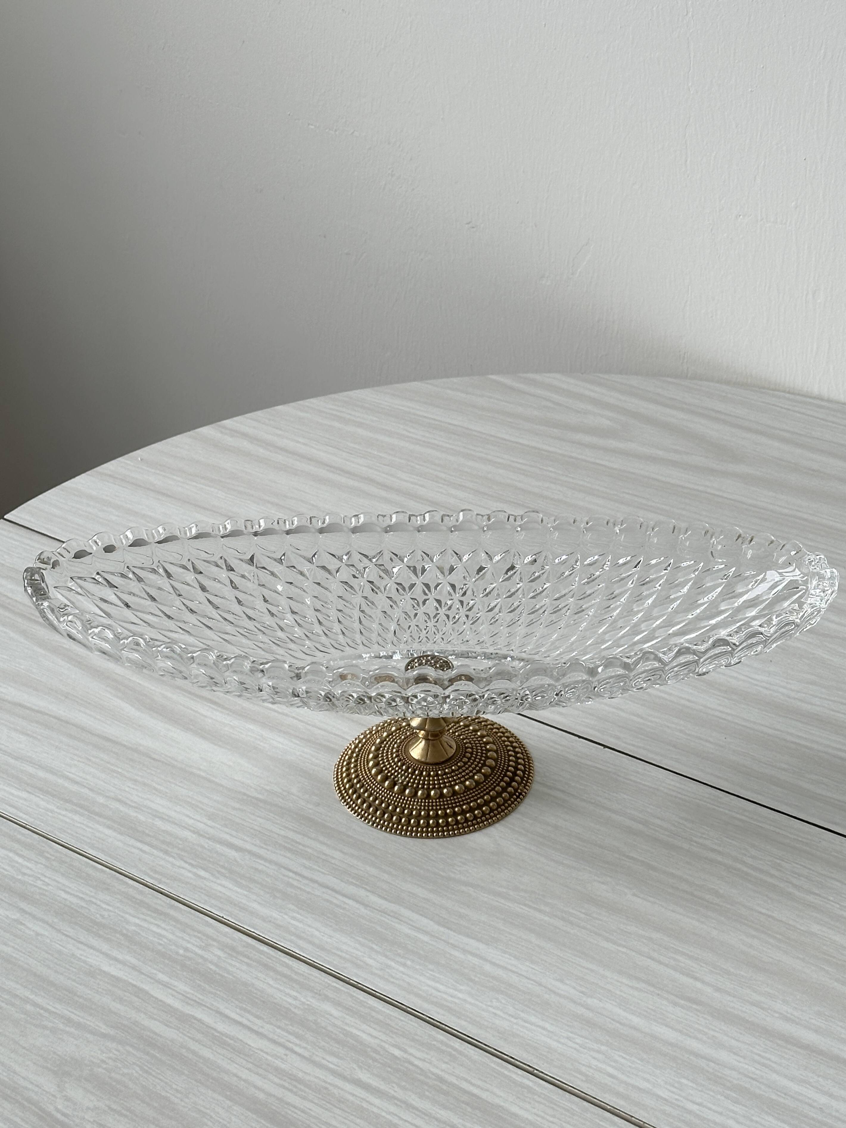 Molded glass bowl with gold metal base