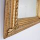 Large gilded wood and stucco mirror with foliage