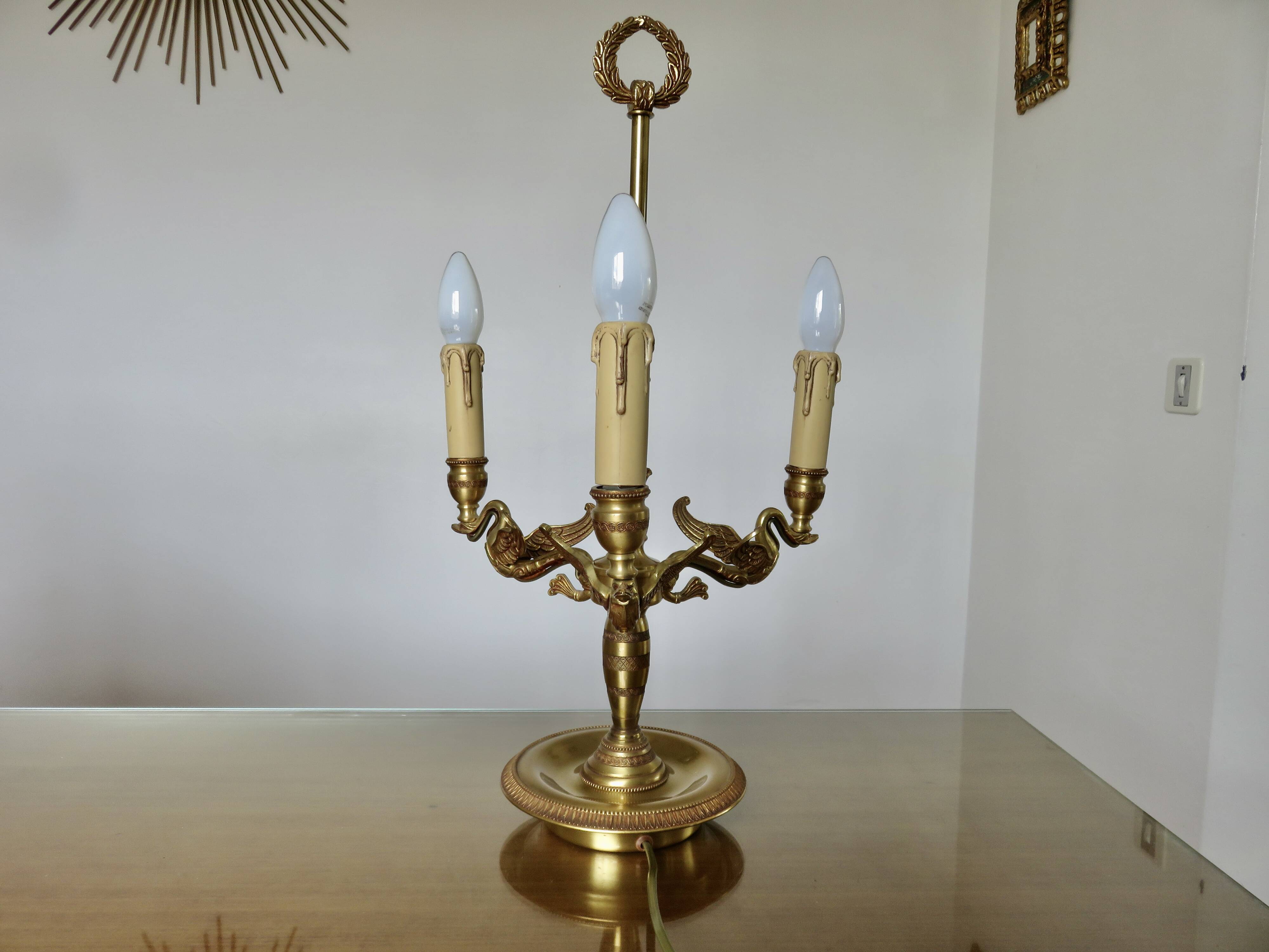 Lucien Gau empire style lamp in solid bronze gilded with bright gold "with swans"