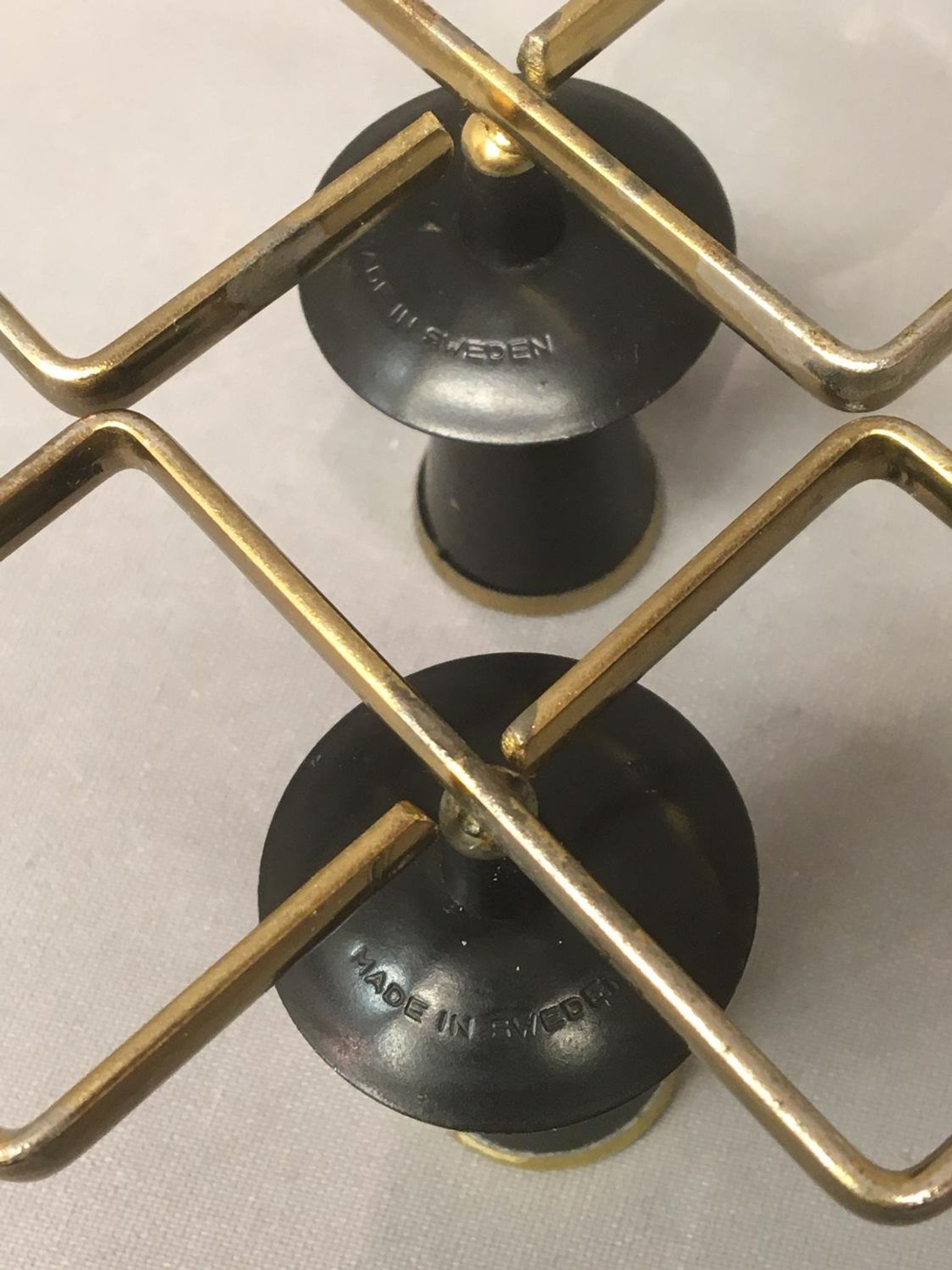 Pair of vintage candle holders in black metal and brass Sweden 1960