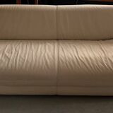 2 seater leather sofa in off-white with a rounded shape