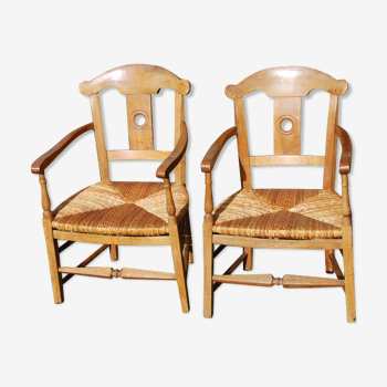 Pair of mulched armchairs corner of the fire Director in cherry. 18th century.