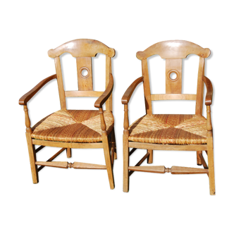 Paire de fauteuils paillés coin du feu Directoire en merisier. XVIIIéme s.