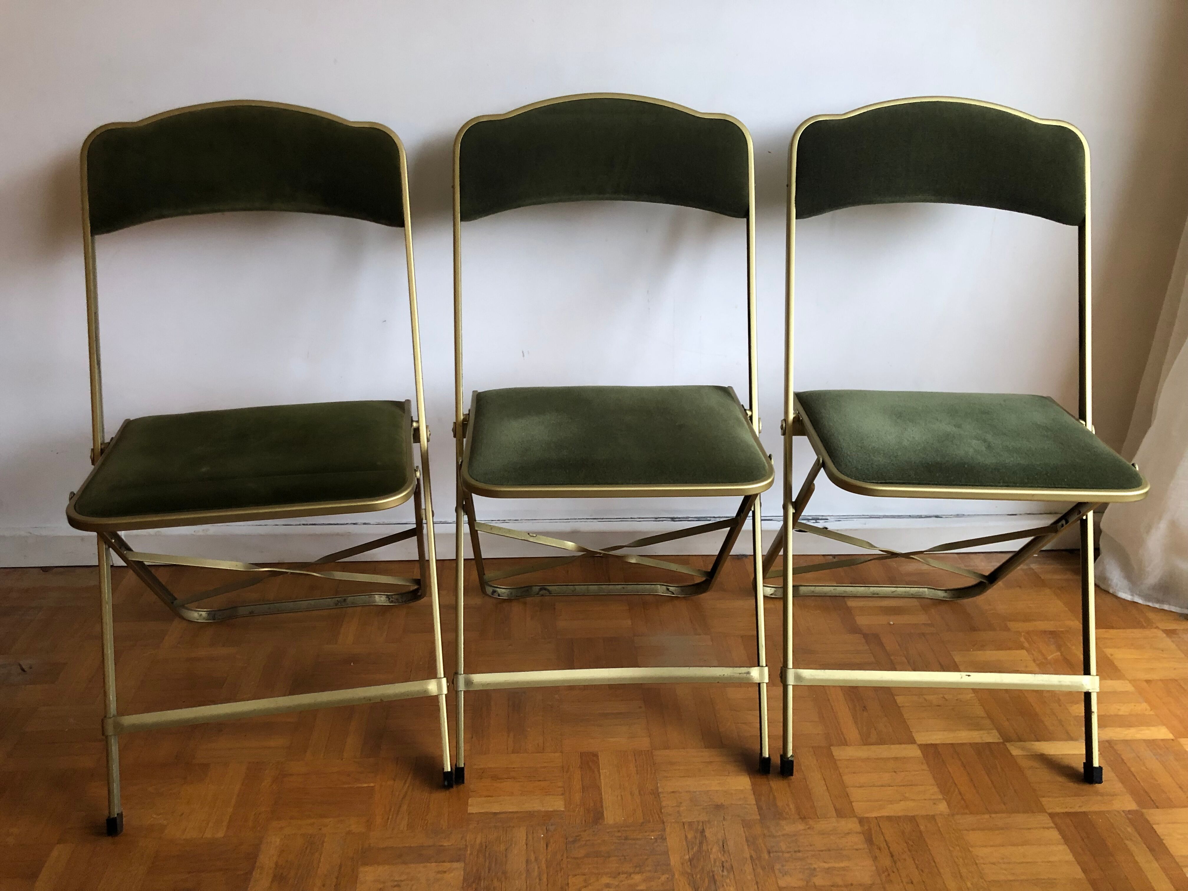Set of three vintage green folding chairs
