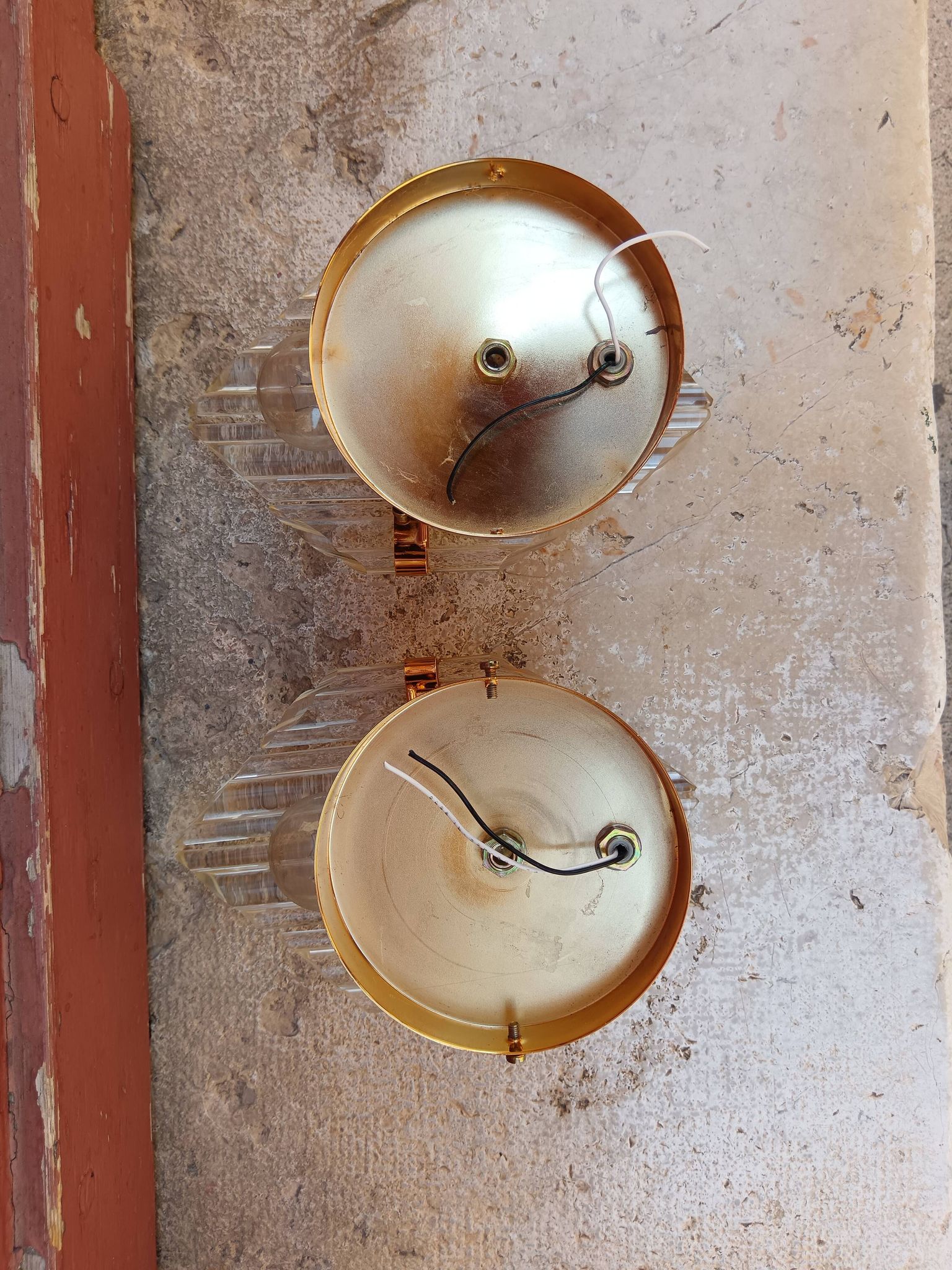 Pair of wall sconces in crystal glass and gilded brass. Venini style.