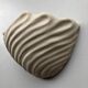 Shell-shaped ceramic applique handcrafted.