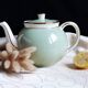Antique Villeroy and Boch ceramic teapot in gold and celadon green.