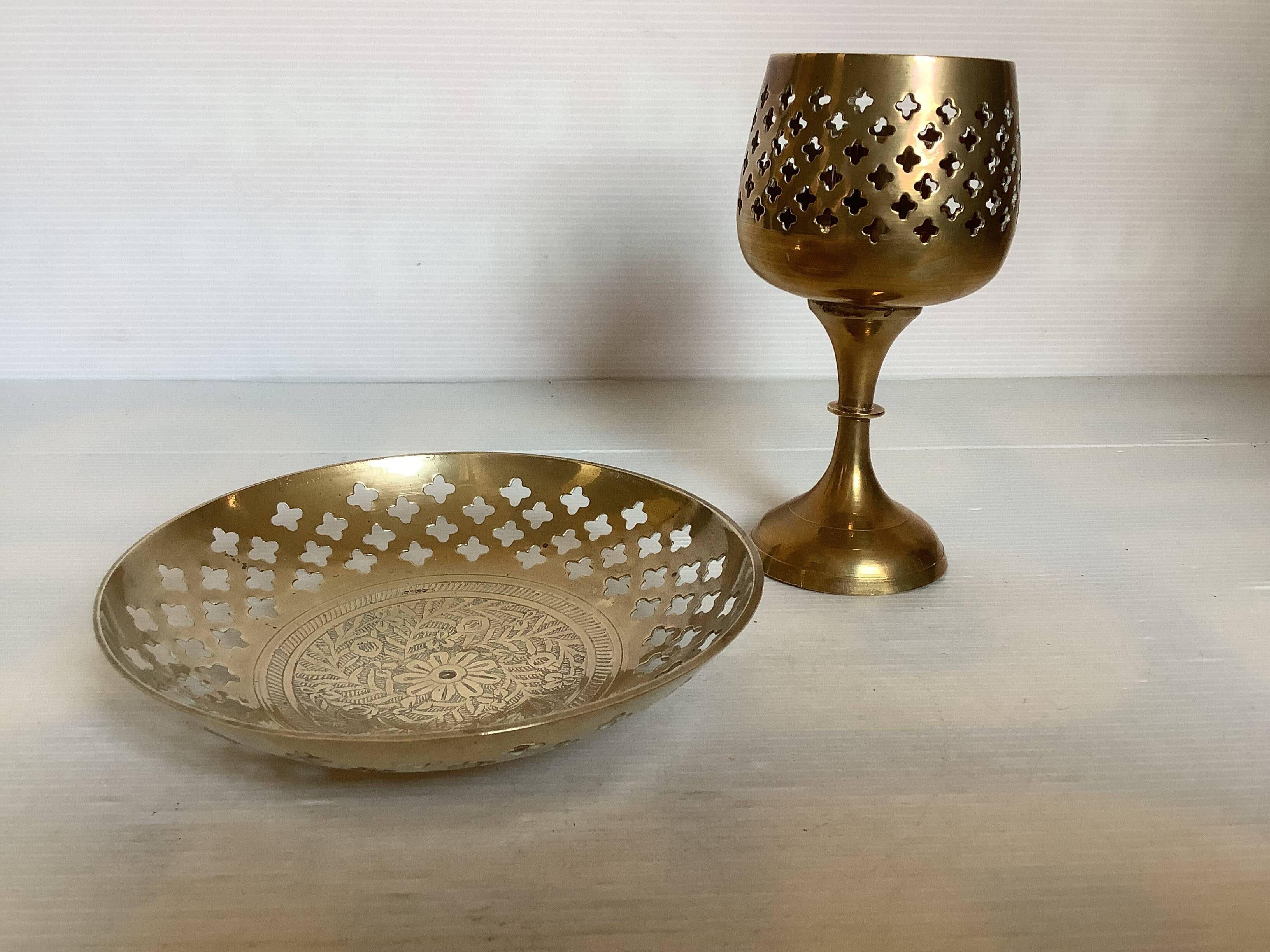 Lattice brass catchall and candlestick.