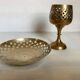Lattice brass catchall and candlestick.