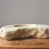 White marble ashtray with a raw appearance