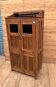 Art Deco glass-fronted cabinet in Burmese teak with original patina.