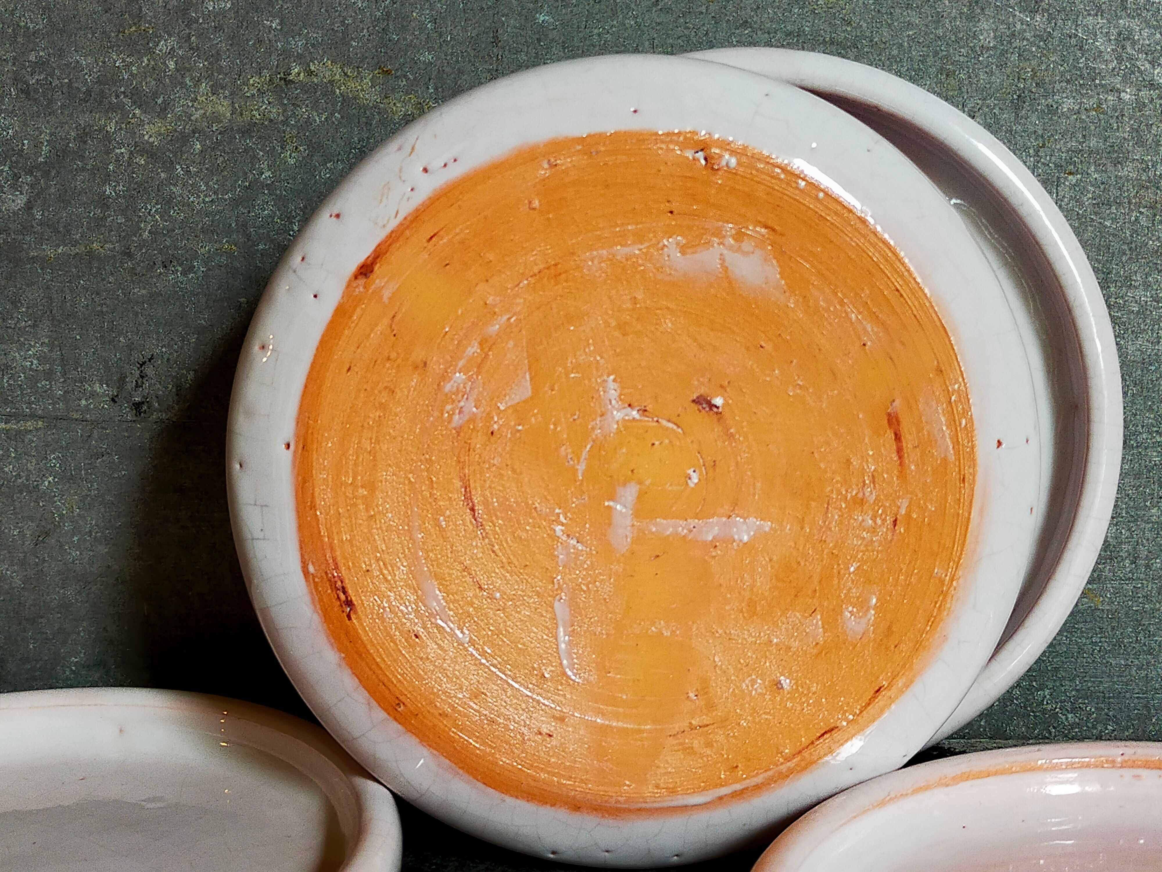 Six antique enamelled earth cut-cups