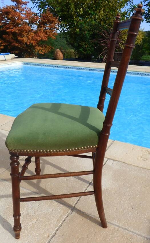 1 solid wood chair with green velvet top and nails