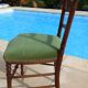 1 solid wood chair with green velvet top and nails