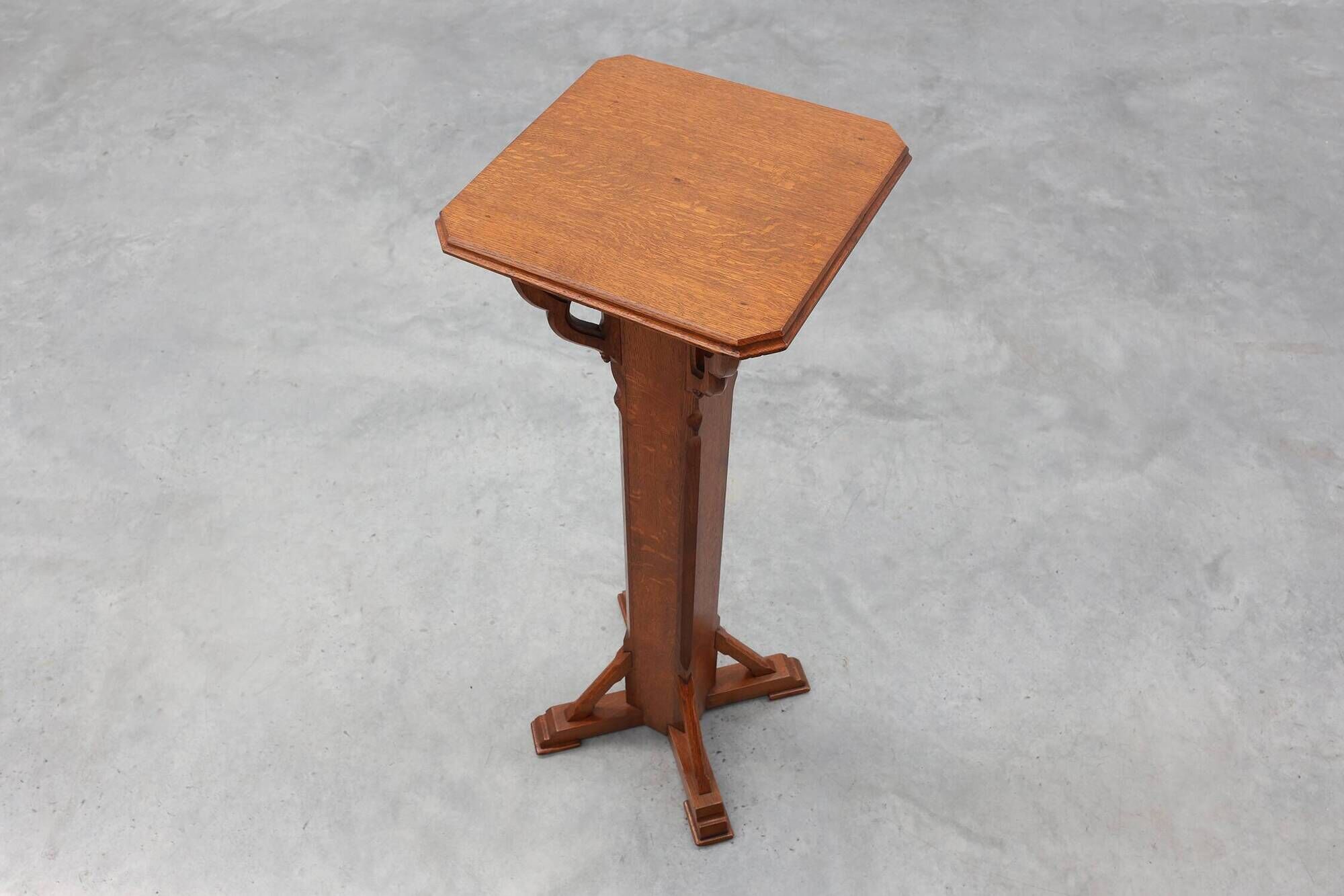 Art Deco oak pedestal with pierced brackets and cross base, Belgium 1920s