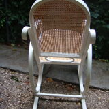 Antique caned rocking chair