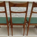 6 modern chairs with banded backs and green faux leather seats