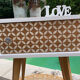 Beautiful vintage bedside table with tapered legs, Scandinavian/pop style in raw white.