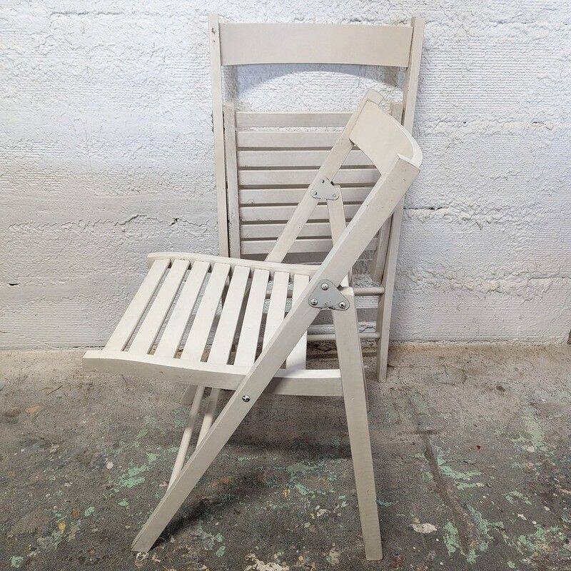 Pair of white wooden folding chairs