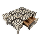 An Art Deco Op Art coffee table made of beech wood with drawers.
