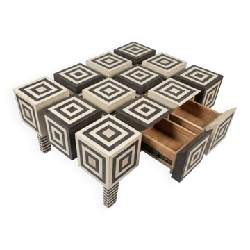 An Art Deco Op Art coffee table made of beech wood with drawers.