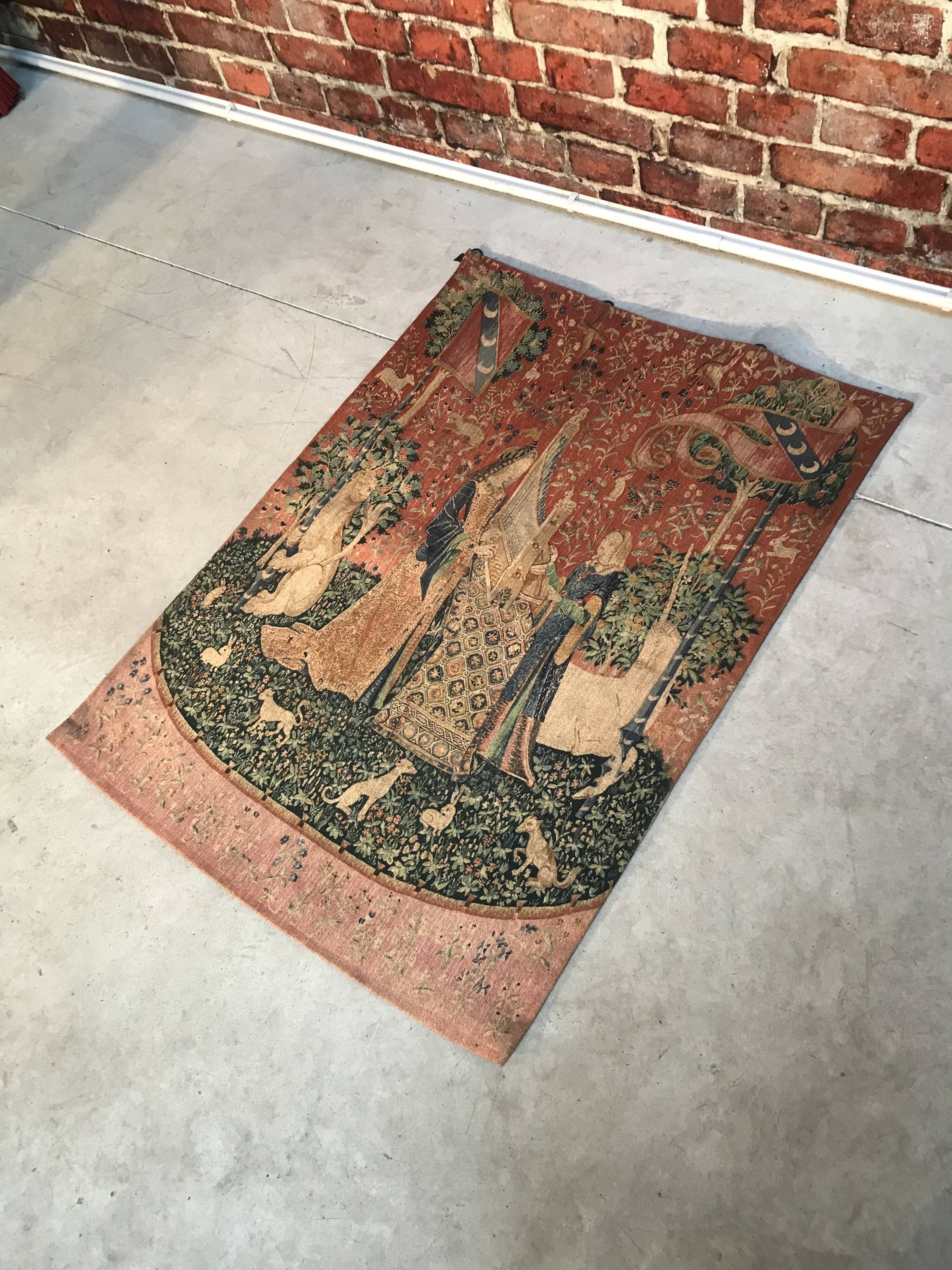 Tapestry reproduction of the lady with the unicorn