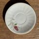 Pair of white porcelain cups from ADP France with a floral pattern and their s