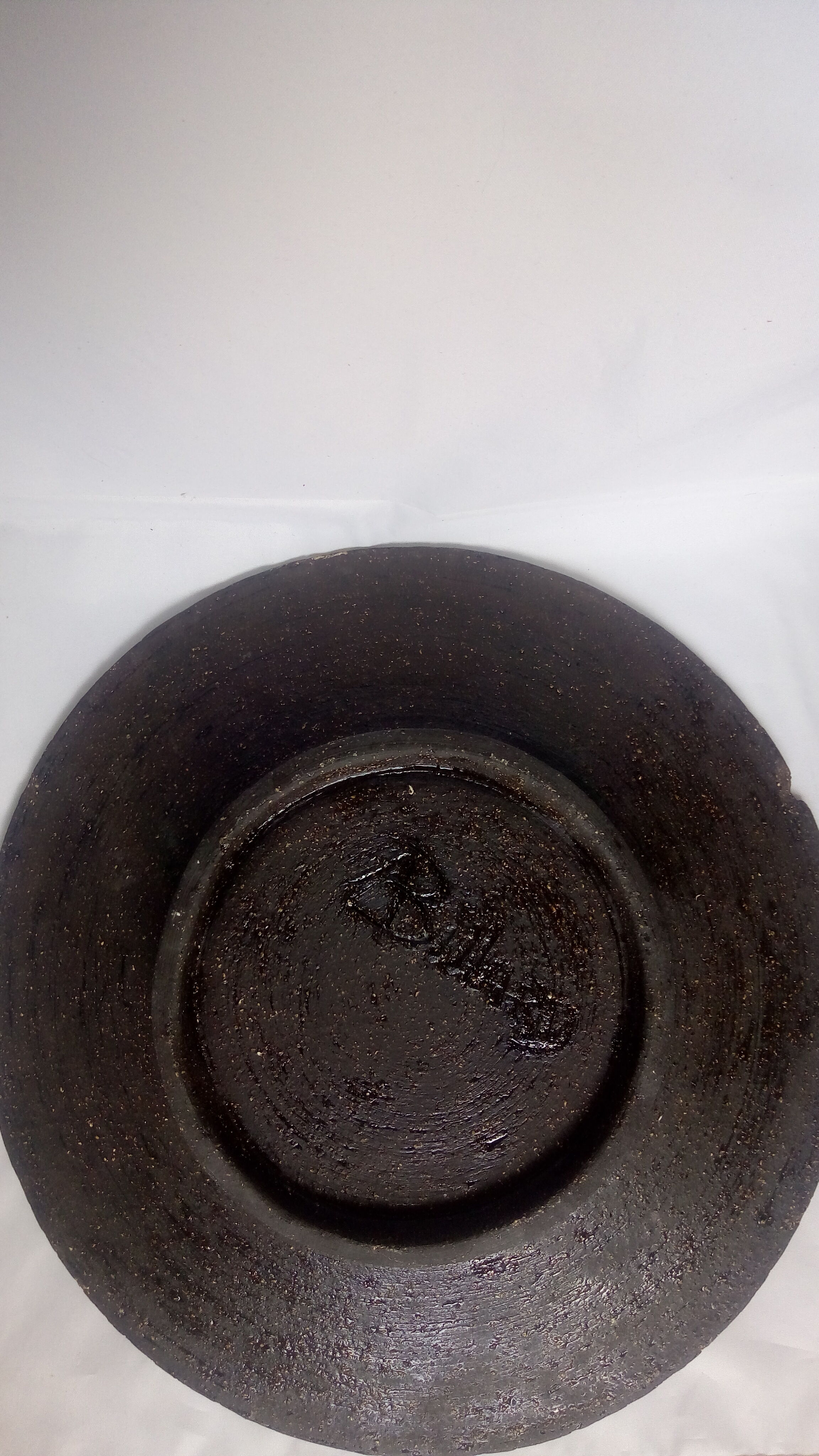 Large black and white brutalist dish