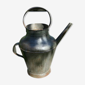 Old steel watering can