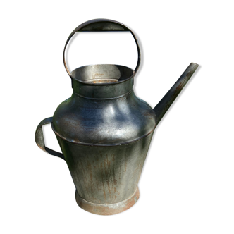 Old steel watering can