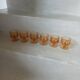6 small vintage orange glasses