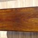 Antique walnut console table with honey spoon legs.