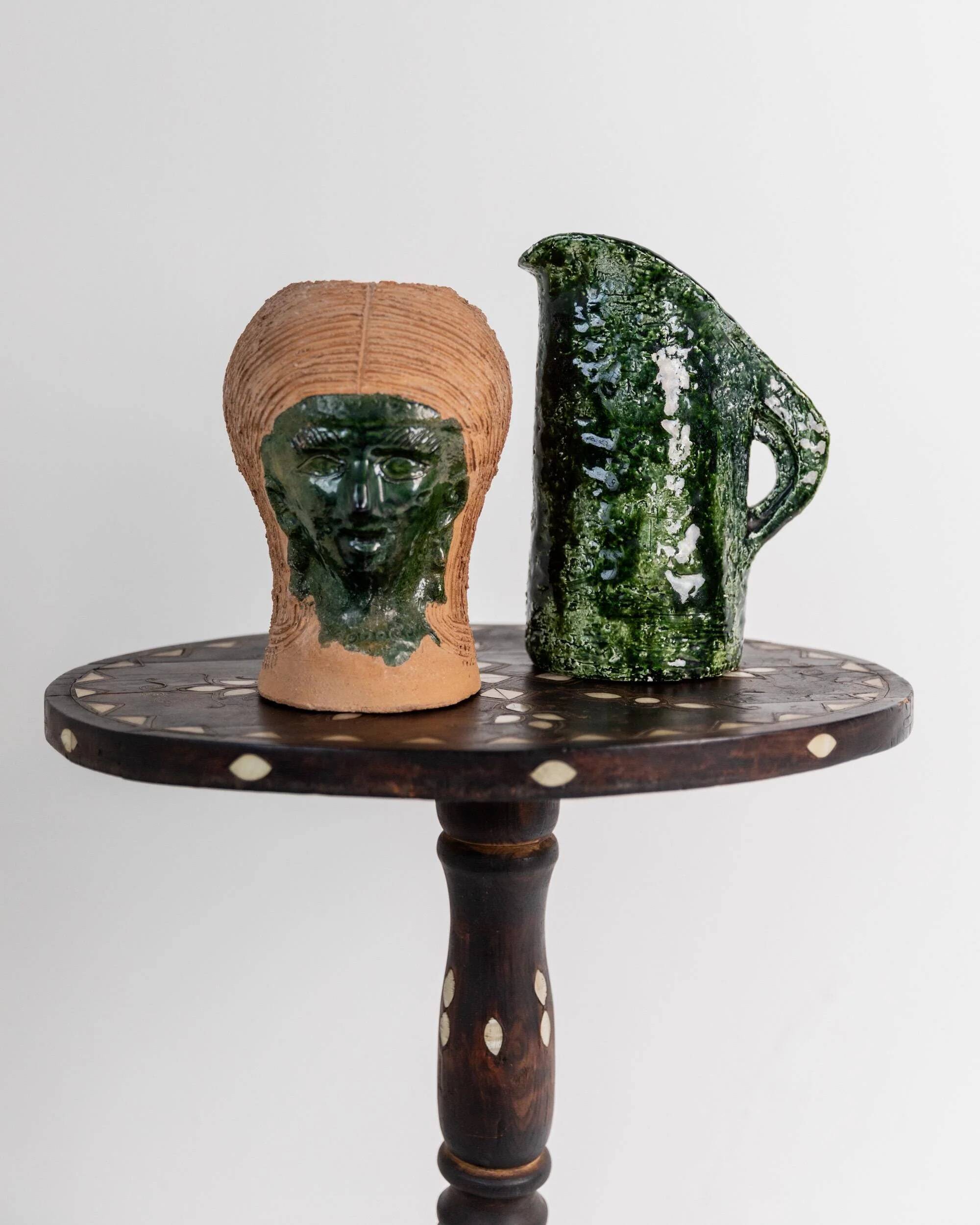 Vintage ceramic vase from the 1980s, sculptural head shape with a green glazed face, terracotta art object.