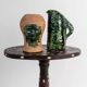 Vintage ceramic vase from the 1980s, sculptural head shape with a green glazed face, terracotta art object.